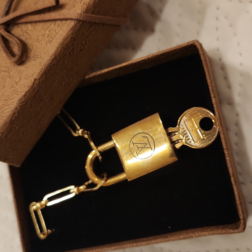 AUTHENTIC LOUIS VUITTON Vintage Lock and Key on a Gold Plated Chain Neck…